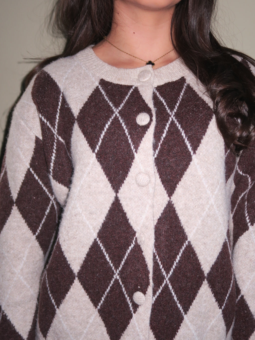 Front view of argyle knit cardigan